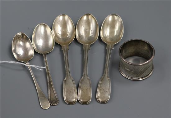 A silver napkin ring and five assorted silver teaspoons including three Victorian.